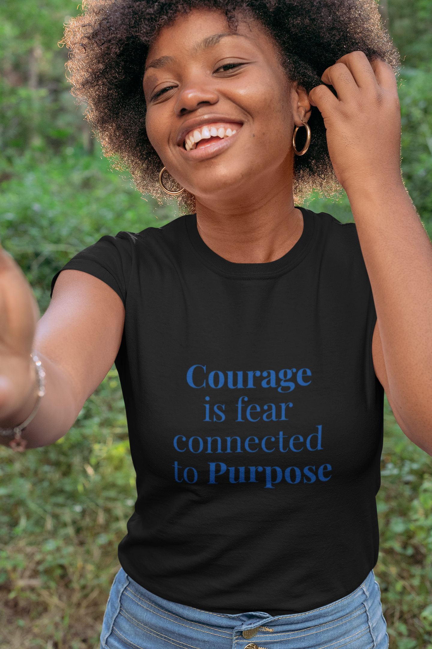 young black girl wearing black custom t-shirt with blue letters